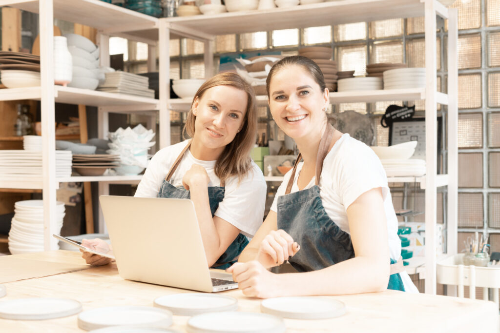 Two woman working at their side hustle.